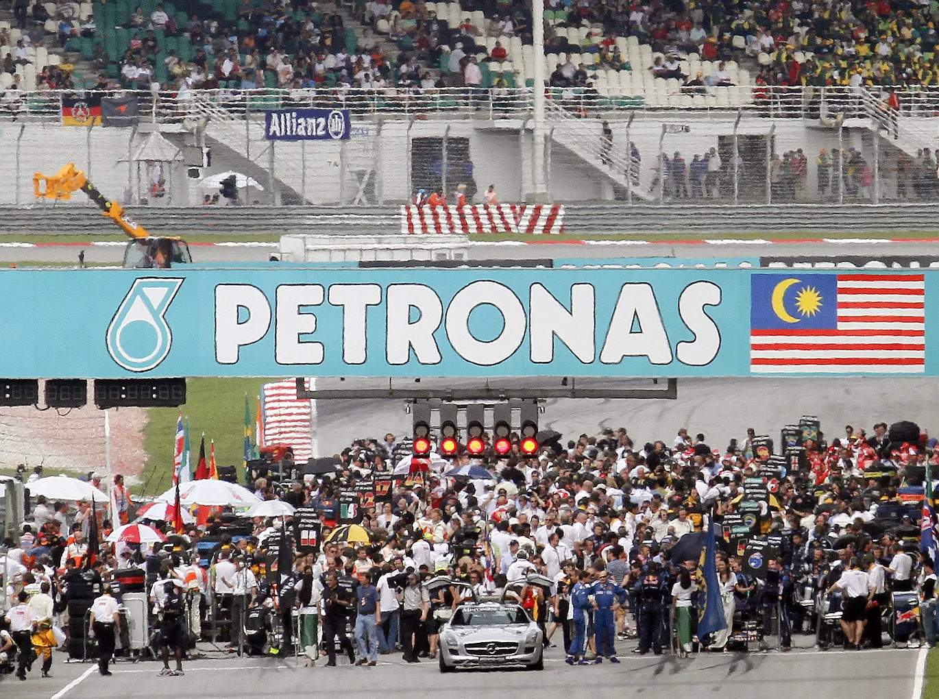 Formula 1 cars lined up on a grand prix starting grid